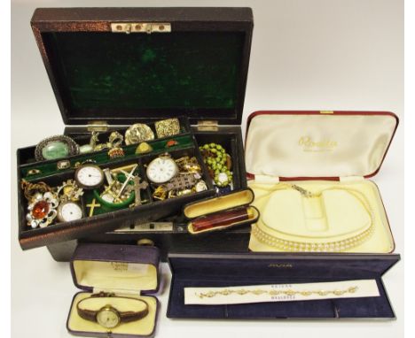 A Moroccan leather jewellery case containing an 18ct sapphire &amp; diamond ring size L 1.5g; a 15ct gold set with emeralds &