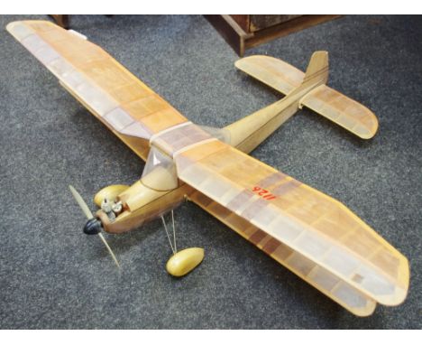 A scratch built model aeroplane from the Walton collection - a Peter Holland design (c.1954) balsa wood biplane with an Irvin