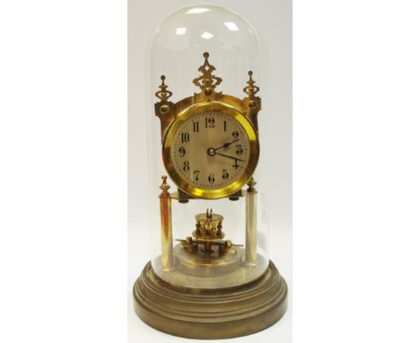 An early 20th Century anniversary clock, in the style of Gustav Becker, the movement and circular dial raised on two brass co