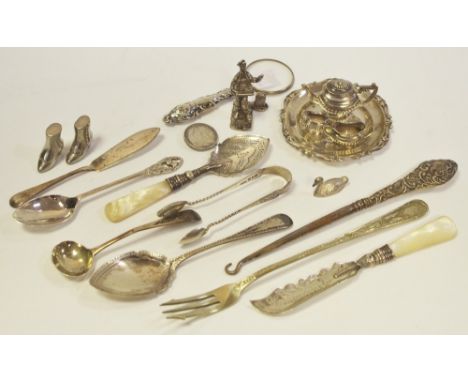 A white metal miniature four piece tea service stamped 800; miniature silver magnifying glass; etc 