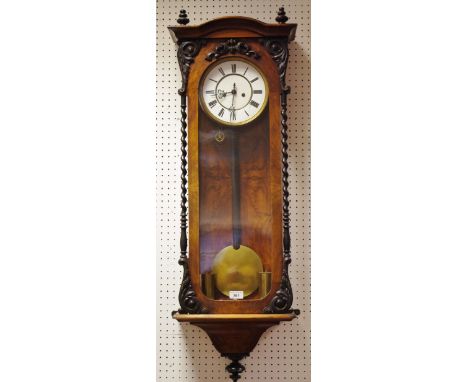 A walnut Vienna wall clock enamelled dial, Roman numerals, glazed door flanked by barley twist columns