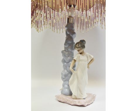 A Nao figural table lamp