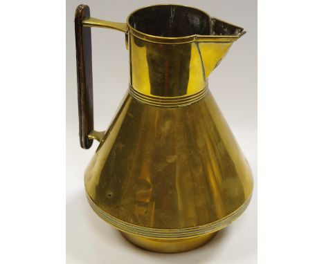 A 19th century brass jug or pitcher, after a design by Christopher Dresser