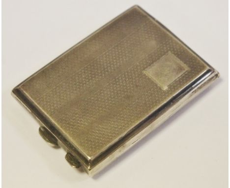 A George V silver match book case, engine turned overall, gilt interior, Birmingham 1934