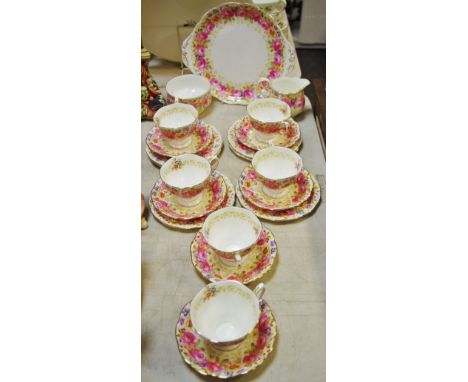 A Royal Albert Serena pattern tea service comprising six tea cups and saucers, side plates, milk jug, sugar bowl and sandwich