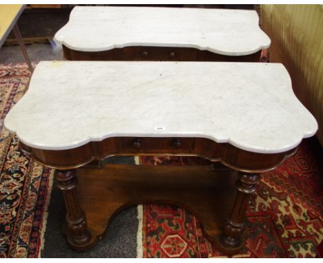 A pair of late 19th century oak and marble topped duchess console tables, one drawer to frieze, turned fluted supports, inver