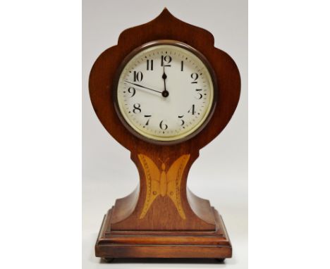 An Edwardian mahogany mantel clock, with central satinwood butterfly shaped inlay to waist, Arabic numerals, bun feet 