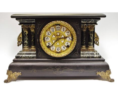 A reproduction Belge noir style mantel clock, the white enamel dial with twin winding holes and stylized numerals, gilt metal