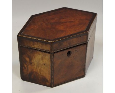 A Regency walnut tea caddy of elongated hexagonal form with barber pole stringing throughout, with lid to interior c.1830 