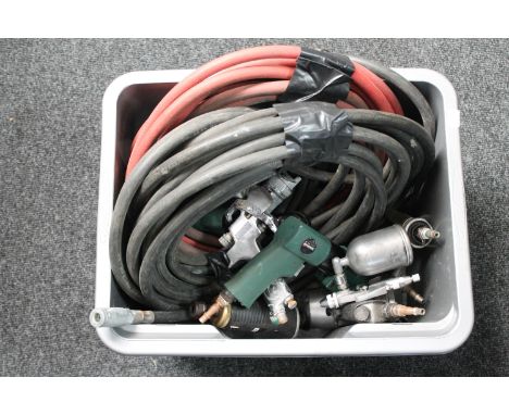A box of compressor tools and hoses 