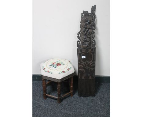 An African carving and a tapestry footstool 