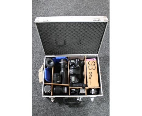 A Nikon D700 camera, in aluminum case with Soligor f=300mm lens, Nikon Prinz Galaxy f=135mm lens, Nikon AF Nikkor 35-80mm and