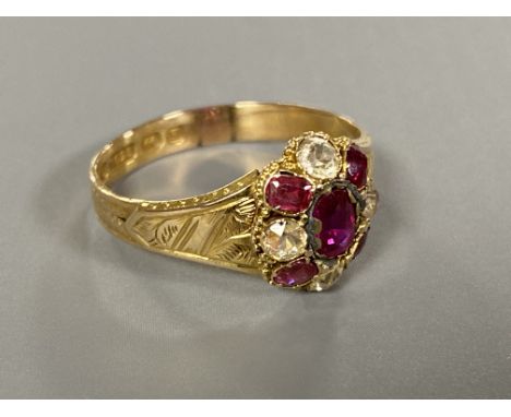 A Victorian 15ct gold ruby ring CONDITION REPORT: In good condition. The stones do not appear to have any chips of abrasions.