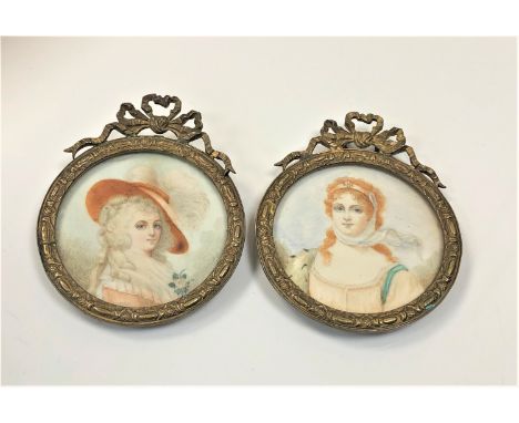 A pair of early 19th century portrait miniatures on ivory, diameter 4.7cm