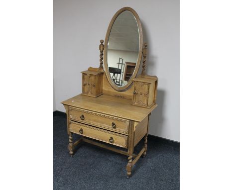 An Edwardian light oak mirrored dressing table 