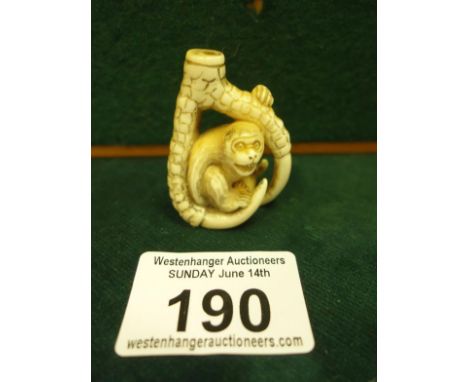 Intricately carved Ivory Netsuke of a Monkey seated within a Claw, 1.5" tall