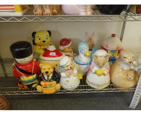 Shelf containing 11 assorted novelty Cookie Jars and lids modelled as animals, ranging in size from 8" high to 14" high