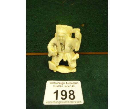 Signed Ivory Netsuke c1900-1920 of a Workman in costume, 2" tall detailed work to costume,