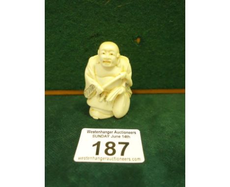 Ivory Netsuke of a seated Buddha 2" tall signed to base, c1930's