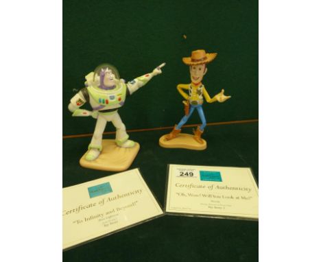 Disney Showcase figurines with certificates of authenticity, Toy Story Buzz Light-year, Toy Story Woody, each figurine 7" tal