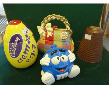 3 x Novelty cookie jars and lids, 1 modelled as a Cadburys Cream Egg, 1 as M & M Sweets and 1 modelled as a Handbag, and a ti