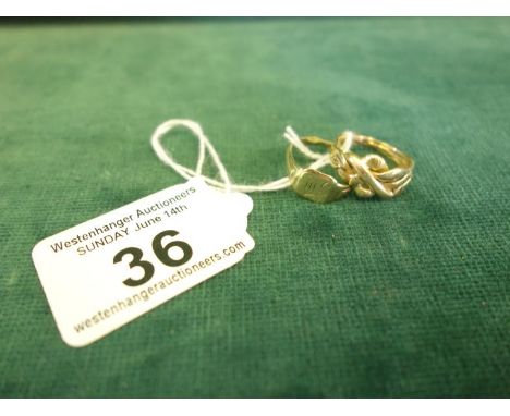 2 x small gold rings, 1 marked 9ct 5.6 grams, 1 other puzzle ring,