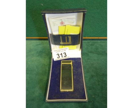 Good quality Dunhill Cigarette lighter with original box and instructions, black and gold decoration