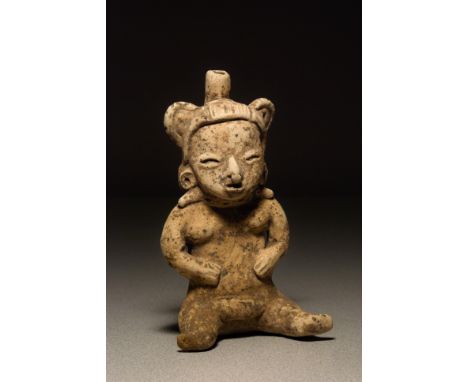 Preclassic Maya seated whistle figure, Chalchuapa type, 500-200 BCE, Buff earthenware, solid and hollow sections, hand- model