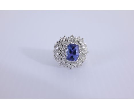 14K White Gold Tanzanite &amp; Diamond Ring Comes with AIGL appraisal Approx. Total Weight: 8.2 g Ring Size: 6.25 Approx. Dia