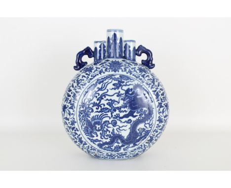 Chinese blue and white porcelain moon-flask vase, Qianlong mark. Provenance: Private Montreal, Canada estate. Dimensions: 10 