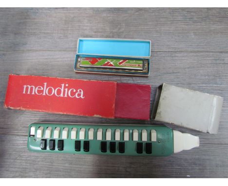 A Hohner Melodica and a Bandmaster harmonica (2)