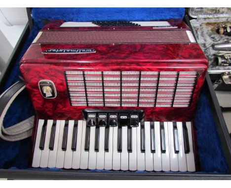 A Weltmeister "Stella" 48 bass piano accordion, cased with keys, includes absolute beginners tutorial book and CD