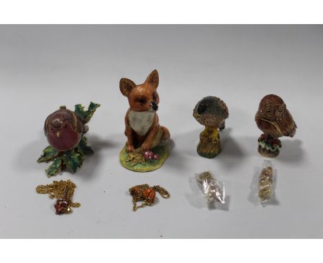 A COLLECTION OF FOUR 'HIDDEN TREASURES' ENAMEL TRINKET BOXES