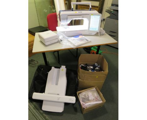 A BROTHER LUMINAIRE INNOV-15 XP1 SEWING AND EMBROIDERY MACHINE, COMPLETE WITH VARIOUS UPGRADE KITS, EXTENSION PLATFORM, SEWIN