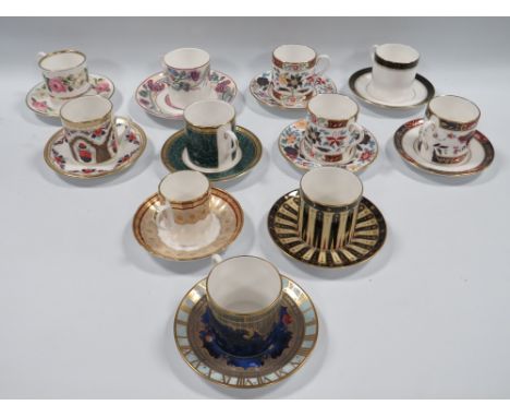 A COLLECTION OF ELEVEN ROYAL WORCESTER COFFEE CANS AND SAUCERS, to include a selection reproduced from designs created for Th