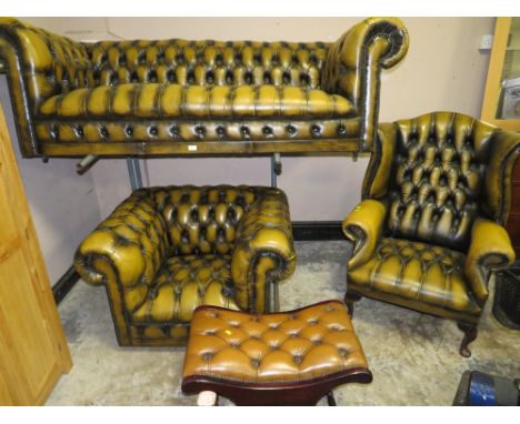 A VINTAGE LEATHER CHESTERFIELD SETTEE , CHAIR AND WING CHAIR WITH STOOL (4)