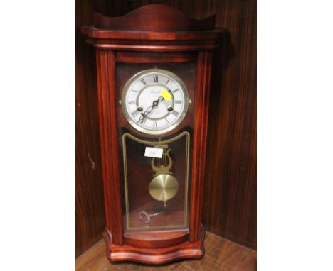 A MODERN LINCON WALL CLOCK 