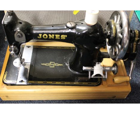 A CASE VINTAGE JONES SEWING MACHINE 