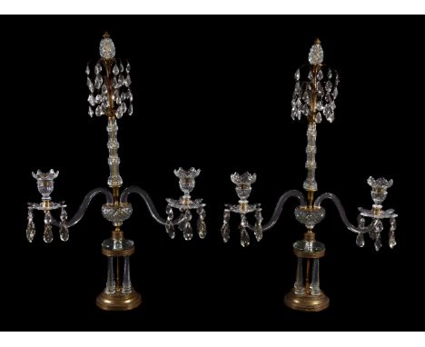 A pair of gilt metal and cut glass twin light lustre candelabra in Regency taste, early 20th century, each with hobnail cut '