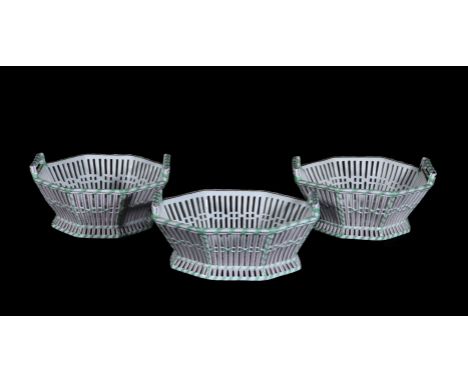 Three German porcelain two-handled vases, Berlin or Dresden, first half 19th century, two of octagonal form and one of shaped