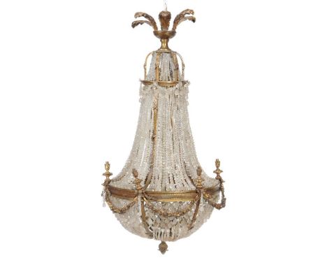 A gilt metal and cut glass bead swagged six light chandelier in Regency taste, early 20th century, of inverted trumpet form, 