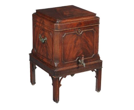 A George III mahogany wine cooler, circa 1760, in the manner of Thomas Chippendale, the hinged lid with cavetto moulded edge 