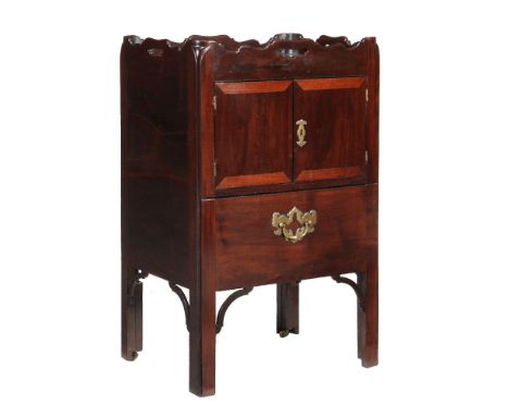 A George III mahogany tray top night commode, circa 1780, the rectangular top with shaped gallery above a pair of cupboard do