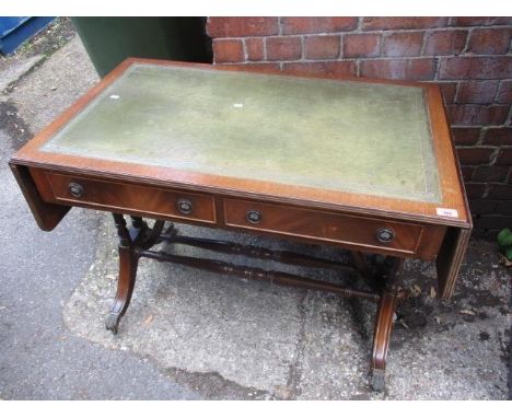 A reproduction mahogany sofa table having a green leather top and two drawers, 30" h x 40" w 