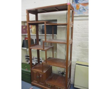 A modern Chinese hard wood open shelf unit with a matching sideboard 