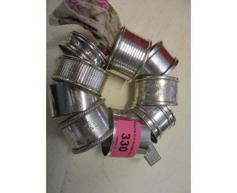 Ten silver napkin rings with engraved and engine turned decoration 