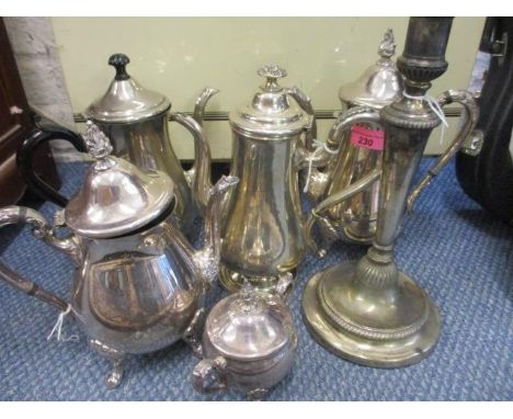 Silver plate to include a three piece teaset, two coffee pots and a candlestick 