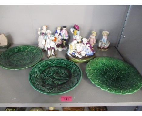 A selection of continental ceramic figures to include Conte & Bohme match strikes, together with three Victorian green leaf p