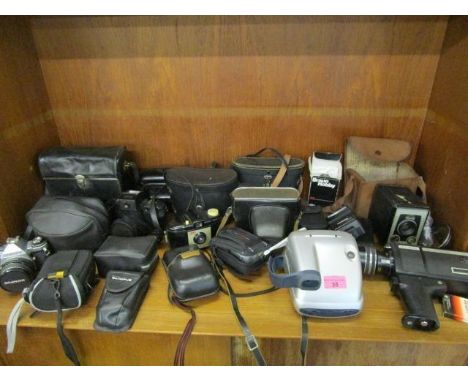 A selection of vintage cameras and binoculars to include a Polaroid camera 