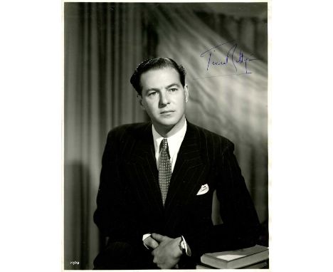 RATTIGAN TERENCE: (1911-1977) English playwright and screenwriter. A good vintage signed 7.5 x 10 photograph, the image depic